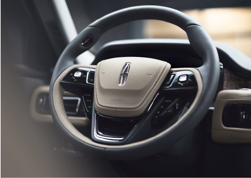 The intuitively placed controls of the steering wheel on a 2023 Lincoln Aviator® SUV | Varsity Lincoln in Novi MI