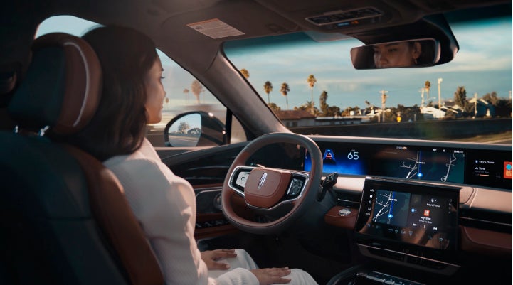 A person is shown driving hands-free on the highway with available Lincoln BlueCruise technology. | Varsity Lincoln in Novi MI