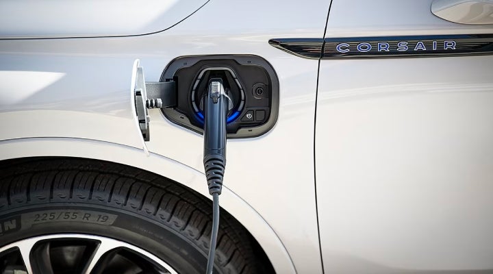 An electric charger is shown plugged into the charging port of a Lincoln Corsair® Grand Touring
model. | Varsity Lincoln in Novi MI