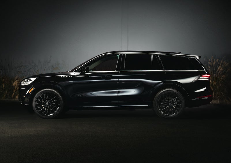 A 2024 Lincoln Aviator® SUV is shown in the Infinite Black exterior color | Varsity Lincoln in Novi MI