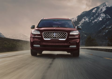 A 2024 Lincoln Aviator® SUV is shown in the Diamond Red exterior color. | Varsity Lincoln in Novi MI