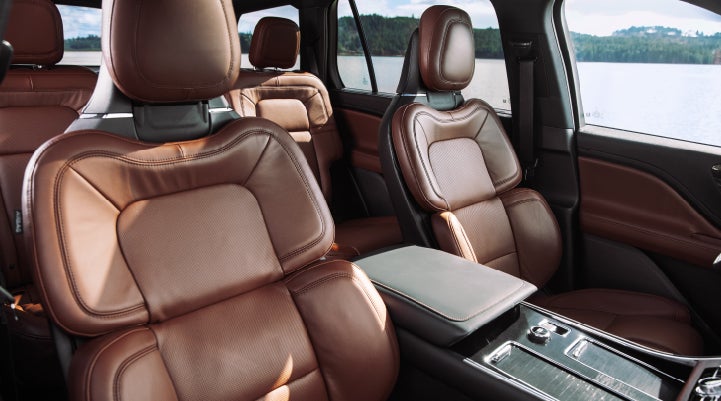 The front row's Perfect Position Seats in a 2024 Lincoln Aviator® Reserve model with Ebony Roast interior | Varsity Lincoln in Novi MI