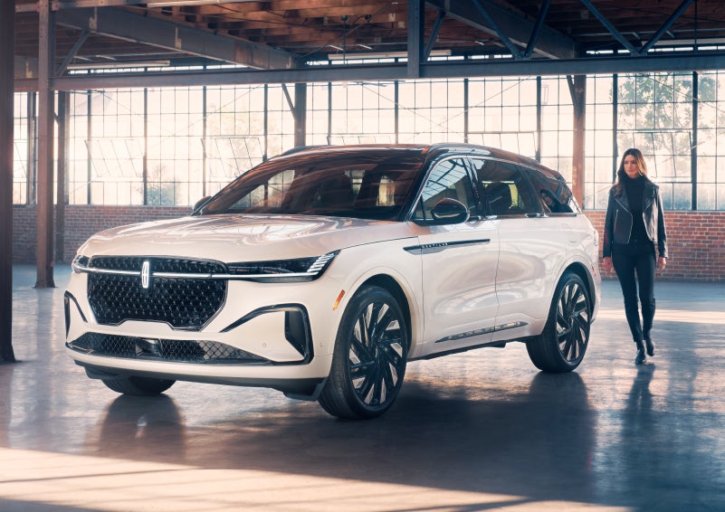 A person approaches a 2024 Lincoln Nautilus® SUV. | Varsity Lincoln in Novi MI