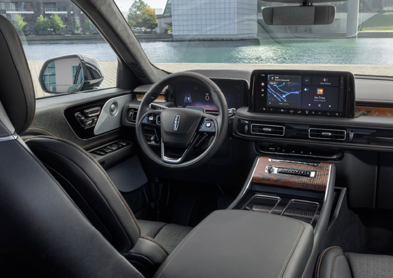 The interior of the 2025 Lincoln Aviator® SUV is shown parked with a view of a harbor through the windshield. | Varsity Lincoln in Novi MI