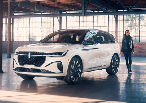 A person approaches a 2025 Lincoln Nautilus® SUV. | Varsity Lincoln in Novi MI