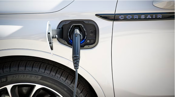 An electric charger is shown plugged into the charging port of a Lincoln Corsair® Grand Touring
model. | Varsity Lincoln in Novi MI