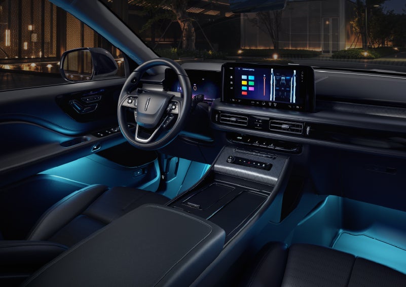 Deep blue ambient lighting glows from various places within a 2026 Lincoln Aviator® SUV. | Varsity Lincoln in Novi MI