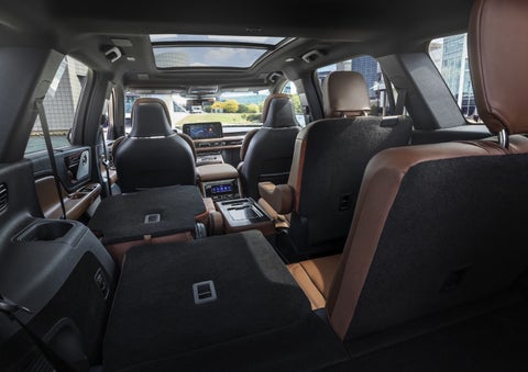 One side of the PowerFold® third-row seat and a second-row seat are folded forward in the 2026 Lincoln Aviator® SUV. | Varsity Lincoln in Novi MI