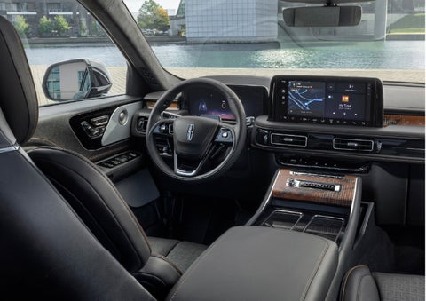 The interior of the 2026 Lincoln Aviator® SUV is shown parked with a view of a harbor through the windshield. | Varsity Lincoln in Novi MI