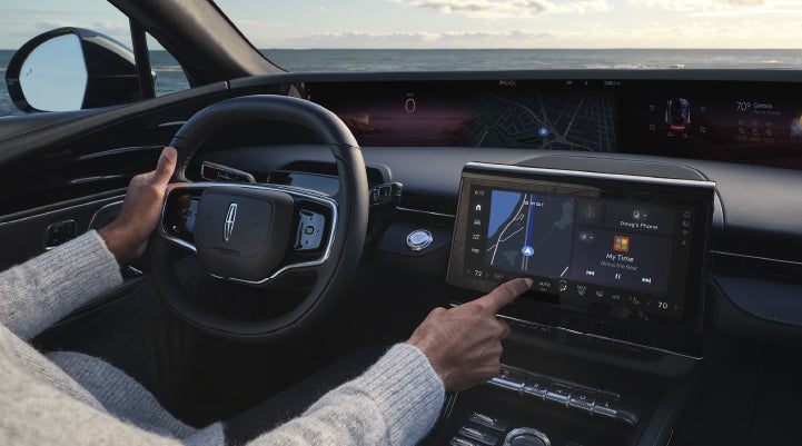 The driver of a 2026 Lincoln Nautilus® SUV interacts with the new Lincoln Digital Experience. | Varsity Lincoln in Novi MI