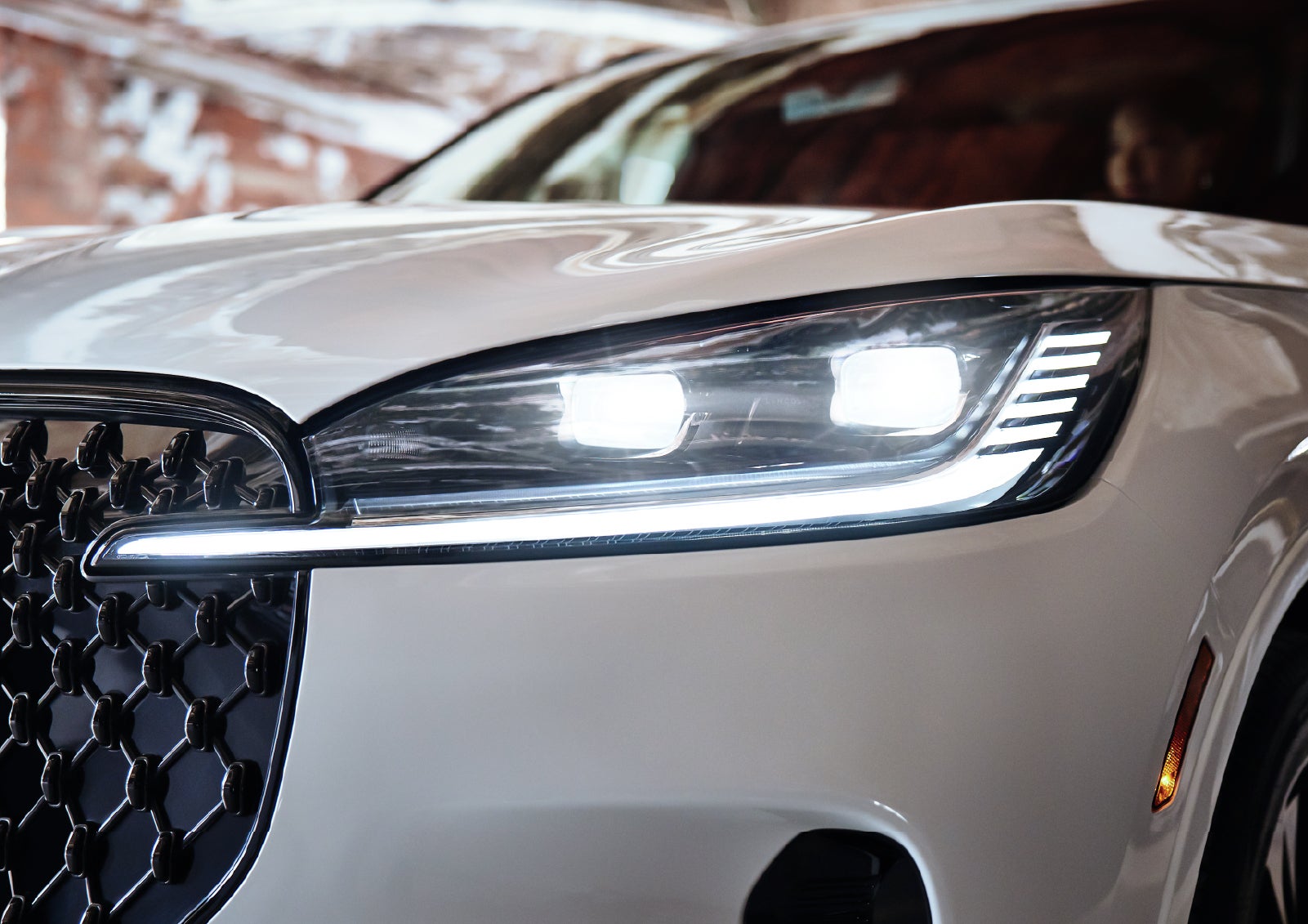 A close-up of a headlamp on the 2027 Lincoln Aviator® SUV is shown. | Varsity Lincoln in Novi MI
