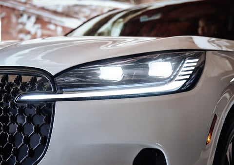 A close-up of a headlamp on the 2027 Lincoln Aviator® SUV is shown. | Varsity Lincoln in Novi MI
